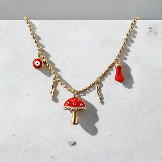 Gold multi charm necklace with mushroom, evil eye, cornicello, and lightning bolt charms